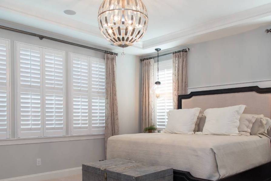 Elegant bedroom with stylish window coverings Miami, featuring custom blinds and shades