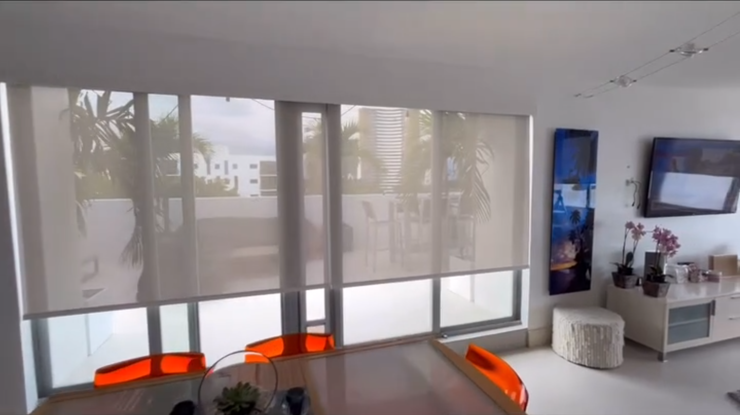 Solar Shades Miami in a Modern Living Room - Custom Window Treatments for Enhanced Comfort and Style